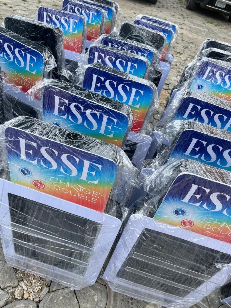 Rows of Esse counter displays wrapped in cling film outdoors, ready to load.
