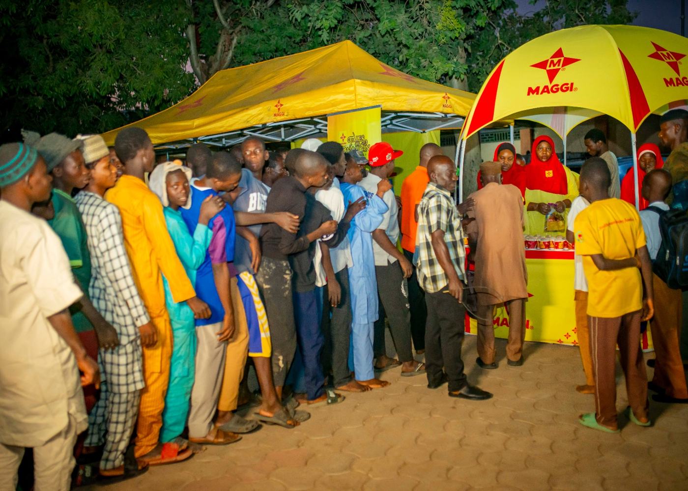Consumers queuing at the branded Maggi Star booth and canopy before iftar.