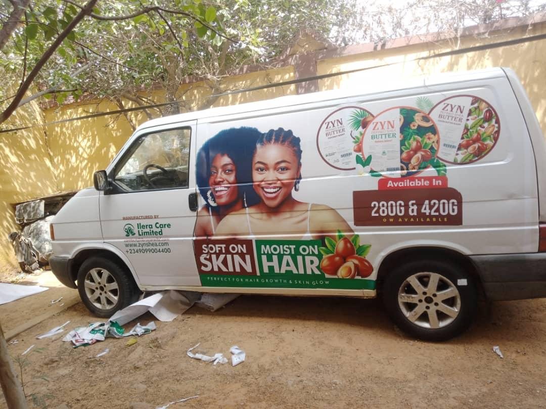 A white van carrying Zyn Refined Shea Butter artwork along its full side panel.
