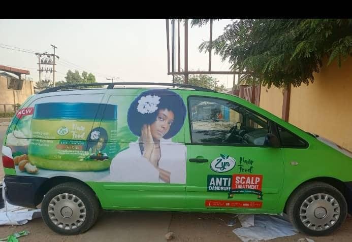 A van wrapped bright green for Zyn Hair Food anti dandruff scalp treatment.