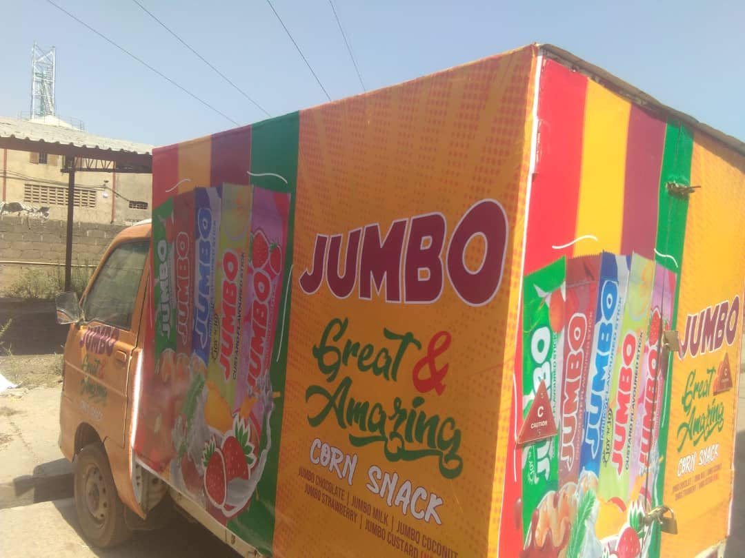 A box truck wrapped on every panel in Jumbo corn snack artwork.