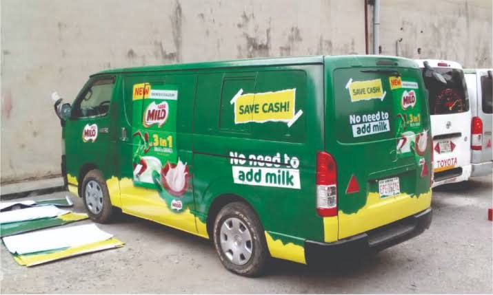 A green and yellow van wrapped for Milo 3-in-1 with the No need to add milk line.